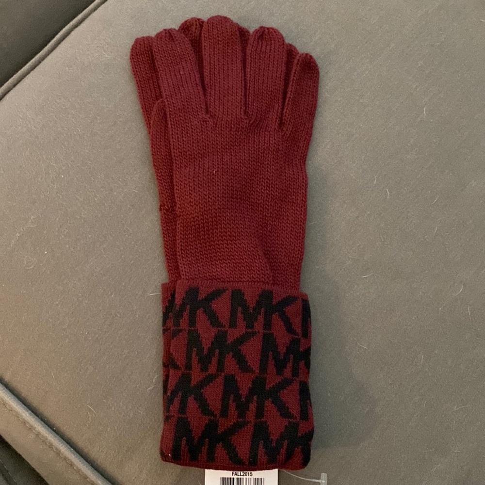 MK wine colored gloves. Brand new with tag. Kept in plastic bag.